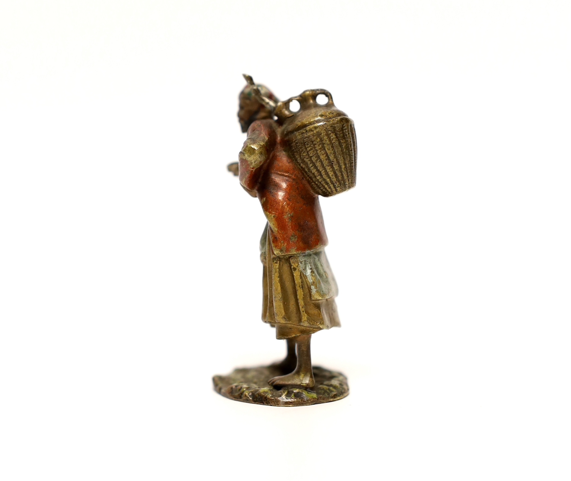 A cold painted bronze figure of an Arab coffee seller, 5.5 cm high